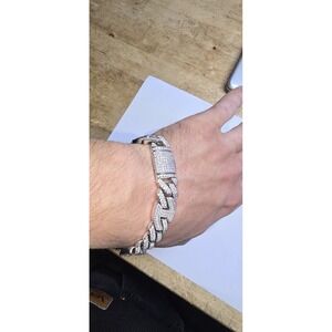 metal Miami Cuban link bracelet featuring a prominent iced-out baguette